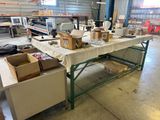 a table with boxes and boxes on it in a warehouse