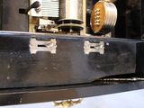 a black suitcase sitting on top of a metal shelf