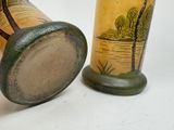 two vases sitting next to each other on a table