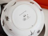 a white plate with a black and white design on it