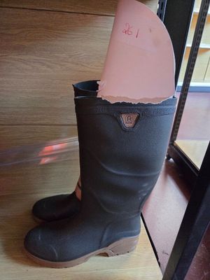 a boot that has a piece of paper sticking out of it