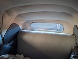 a view of the back seat of a car from inside the vehicle