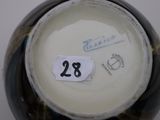 a black and white vase with a number 28 on it