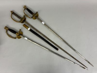 three old swords are sitting on a white surface next to a pair of scissors