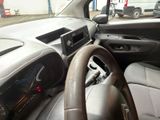dashboard of a car with a steering wheel and dashboard controls