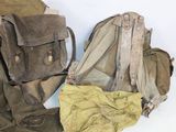 a pile of bags sitting on a table next to each other