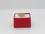 a ring in a red box on a white surface