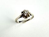 an image of a diamond ring on a white surface