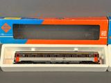 an orange and blue box with a train car in it