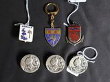four different types of keychains are shown on a black surface