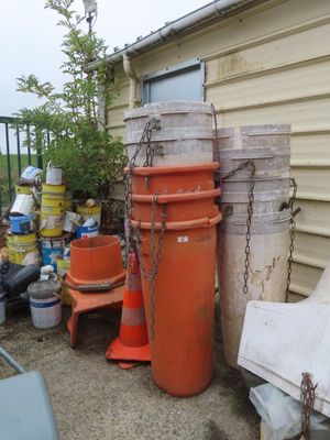 a lot of trash outside of a house with a lot of trash