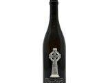 a bottle of wine with a celtic cross on it