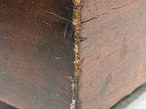 a close up of a wooden box with a metal lid
