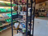 many shelves of food in a store with a lot of items
