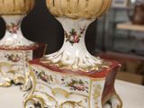 two vases that are sitting on a table