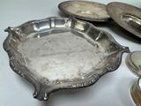 a lot of silver plates on the table