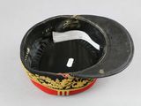 a black hat with gold trim and a red band