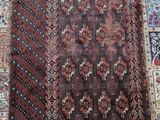 a brown and red rug with a pattern on it