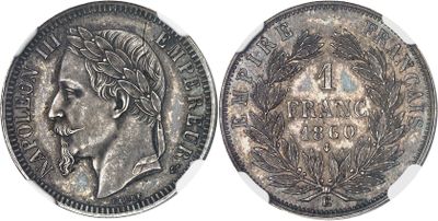 a close up of a silver coin with a woman ' s face