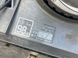 a close up of a car ' s engine with a number plate on it