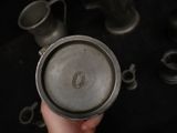 a person holding a metal cup in their hand