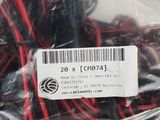a bag of red and black wires wrapped in plastic