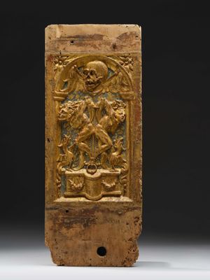 an old wooden block with a carving of a man on a horse