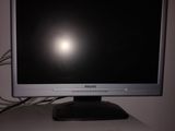 a computer monitor sitting on top of a white desk
