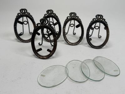 four pieces of glass are sitting next to each other on a table