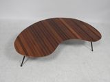 a close up of a coffee table with a wooden top