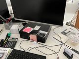 a computer desk with a keyboard, mouse, and monitor on it