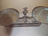 a metal scale with two bowls on top of it