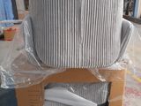 a stack of pillows sitting on top of a cardboard box