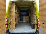 a yellow van that is parked inside of a building