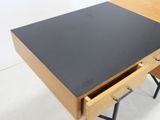 an image of a desk with a black top and two drawers