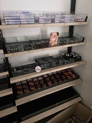 a lot of makeup products on the shelves in the store