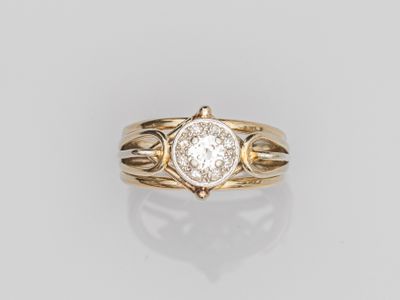a gold ring with a white diamond in the center