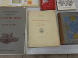 several books are sitting on a table next to each other