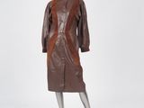 an image of a mannequin wearing a brown leather coat and skirt