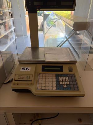 a calculator sitting on a table in front of a window