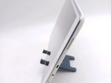 a cell phone that is sitting on top of a stand
