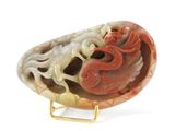 a red and white stone with a dragon on it