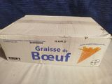 an open box of french fries sitting on top of a table