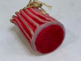 a small red object that is on a white surface