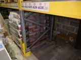 a shelf with a lot of boxes on it in a warehouse