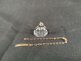 a gold chain with a crown on top of it