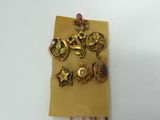 a gold brooch with a bunch of jewels on it