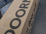 a cardboard box sitting on top of a table next to a shopping cart