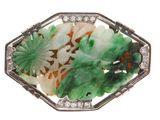 une broche « broochée » verte et blanche ornée de fleurs