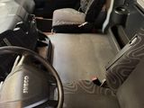 a view of the inside of a bus from the driver ' s seat
